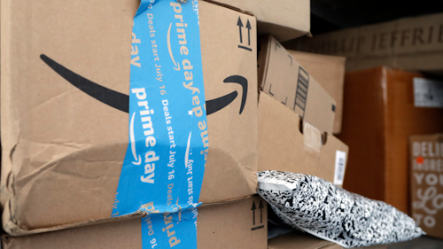 In this July 17, 2018 file photo, Amazon Prime packages sit in a delivery truck before being unloaded in Miami.