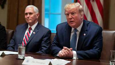 Vice President Mike Pence listens as President Donald Trump speaks during a roundtable on school choice in the Cabinet Room of the White House, Monday, Dec. 9, 2019, in Washington.