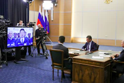 Russian President Vladimir Putin, right, Deputy Prime Minister of Russia Dmitry Kozak, second right, and Russian Minister of Energy Alexander Novak, back to a camera attend a joint video conference with Chinese President Xi Jinping during inaugurating the Power of Siberia pipeline in the Bocharov Ruchei residence in the Black Sea resort of Sochi, Russia on Monday, Dec. 2.