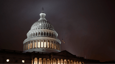 In this Dec. 9 file photo, mist rolls over the U.S. Capitol dome on Capitol Hill in Washington.