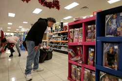 In this Nov. 29, 2019 file photo, Horacio Ment shops at a Kohl's store in Colma, CA.