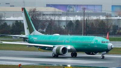 A Boeing 737 Max airplane being built for Norwegian Air International taxis for a test flight, Wednesday, Dec. 11, 2019, at Renton Municipal Airport in Renton, Wash. The chairman of the House Transportation Committee said Wednesday that an FAA analysis of the 737 Max performed after a fatal crash in 2018 predicted 'as many as 15 future fatal crashes within the life of the fleet' during opening remarks at the committee's fifth hearing on the Boeing 737 Max.