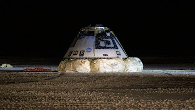 The Boeing Starliner spacecraft is seen after it landed in White Sands, N.M., Sunday, Dec. 22, 2019. Boeing safely landed its crew capsule in the New Mexico desert Sunday after an aborted flight to the International Space Station that threatened to set back the company's effort to launch astronauts for NASA next year.