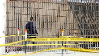 A McAllen K-9 police officer walks past rebar that will make up the border wall before DHS Acting Homeland Secretary Chad Wolf tours and speaks to the local media at the border wall under construction on Thursday, Nov. 21, 2019, south of Donna, Texas.