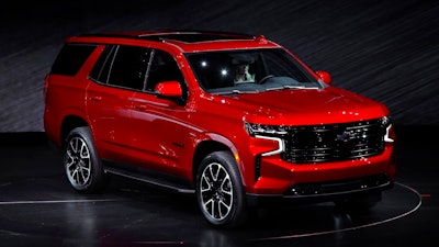 The 2021 Chevrolet Tahoe RST is unveiled in Detroit, Tuesday, Dec. 10, 2019. Global concerns about climate change are not stopping General Motors from making hulking SUVs for U.S. drivers. GM on Tuesday rolled out the next generation of its big truck-based SUVs with more space and features.