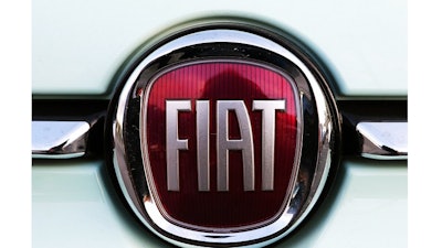 In this Oct. 31, 2019 file photo, a Fiat logo is pictured on a car in Bayonne, southwestern France. Unionized workers at Fiat Chrysler have voted overwhelmingly to approve a new four-year contract with the company. The ratification means the United Auto Workers union has settled with all three Detroit automakers. General Motors workers ratified an agreement in October after a 40-day strike, while Ford Workers settled in November. About 71% of Fiat Chrysler workers voted in favor of the deal, the UAW said Wednesday, Dec. 11, 2019. The union has about 47,000 members at Fiat Chrysler.