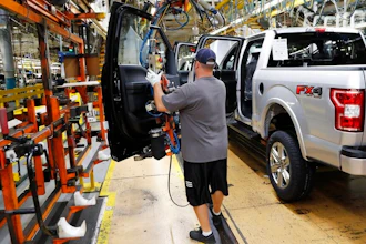 In this Sept. 27, 2018, file photo a United Auto Workers assemblyman installs the front doors on a 2018 Ford F-150 truck being assembled at the Ford Rouge assembly plant in Dearborn, Mich. Ford Motor Co. said Tuesday, Dec. 17, 2019, that it is adding 3,000 jobs at two factories in the Detroit area and investing $1.45 billion to build new pickup trucks, SUVs, and electric and autonomous vehicles. At the Dearborn truck plant $700 million will be invested.
