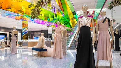 In this Tuesday, Nov. 26, 2019, photo shows a Gucci gown on display in The Vault at the Saks Fifth Avenue Flagship in New York. Millennials and Generation Z accounted for 47% of luxury consumers in 2018 and for 33% of all luxury sales worldwide in 2018, according to a study by consulting firm Bain & Co. Together, however, they contributed to virtually all of the market's growth, compared with 85% in 2017.