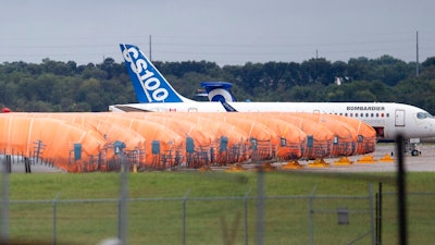 In this Oct. 3, 2019, file photo, completed Boeing 737 MAX fuselages, made at Spirit Aerosystems in Wichita, Kan., sit covered in tarps near the factory. Kansas Gov. Laura Kelly says that the state may have to help pay workers at aircraft parts maker Spirit AeroSystems to keep them on the assembly line if the Boeing 737 Max stays grounded much longer.