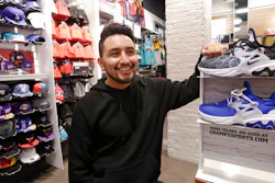 Victor Duran, a co-manager of a sports apparel store at the Southcenter mall, south of Seattle, poses for a photo at the store, Wednesday, Dec. 11, 2019, in Tukwila, Wash. Duran, 23, said he makes about $52,000 a year and doesn't get overtime, but is required to work at least 45 hours per week, and up to 60 during the holidays. Duran is one employee who could benefit from new overtime rules in Washington state, which will allow hundreds of thousands of workers who have been exempt to begin collecting when they work more than 40 hours per week.