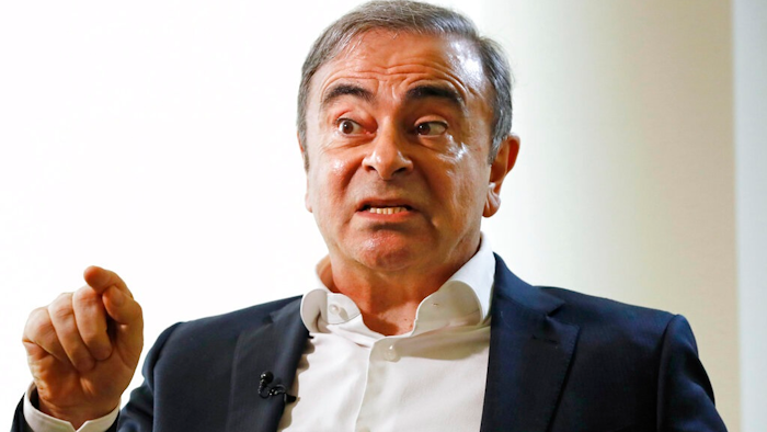 Former Nissan Chairman Carlos Ghosn speaks to Japanese media during an interview in Beirut, Lebanon, Friday, Jan. 10, 2020.
