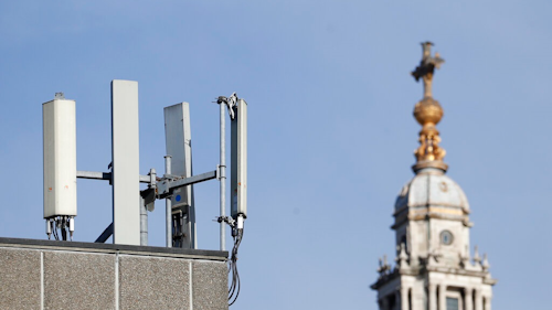 Mobile network phone masts are visible in front of St Paul's Cathedral in the City of London, Tuesday, Jan. 28, 2020.The Chinese tech firm Huawei has been designated a 'high-risk vendor' but will be given the opportunity to build non-core elements of Britain's 5G network, the government has announced. The company will be banned from the 'core', of the 5G network, and from operating at sensitive sites such as nuclear and military facilities, and its share of the market will be capped at 35%.