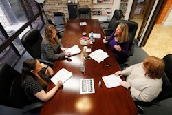 Jo Trizila, top right, President and CEO of Trizcom Public Relations, conducts a meeting with her staff Ann Littmann, right, Noel Hampton, bottom left, and Hayley Swinton at their office in Dallas on Tuesday, Jan. 21. The recent flu outbreak can really impact small businesses with small staffs and hurt a company's productivity. Some owners, like Trizila, are trying to mitigate the damage so the flu will not become a nightmare when they're trying to get clients' work done.