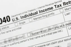 This July 24, 2018, file photo shows a portion of the 1040 U.S. Individual Income Tax Return form.
