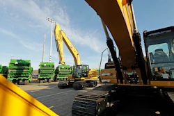 In this Nov. 4, 2019, file photo construction equipment made by Caterpillar are readied for export to Asia at the Port of Tacoma in Tacoma, WA