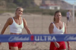 This undated image provided by Michelob ULTRA shows Kerri Walsh Jennings, left, and Brooke Sweat in a scene from the company's 2020 Super Bowl NFL football spot.