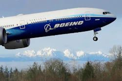 In this Jan. 25, 2020, file photo a Boeing 777X airplane takes off on its first flight with the Olympic Mountains in the background at Paine Field in Everett, Wash. Boeing Co. reports financial results on Wednesday, Jan. 29.