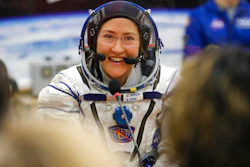 In this Thursday, March 14, 2019 file photo, U.S. astronaut Christina Koch, member of the main crew of the expedition to the International Space Station (ISS), speaks with her relatives through a safety glass prior the launch of Soyuz MS-12 space ship at the Russian leased Baikonur cosmodrome, Kazakhstan. Koch told The Associated Press on Tuesday, Jan. 28, 2020, her 319th consecutive day in space _ that taking part in the first all-female spacewalk was the highlight of her mission. She's been living on the International Space Station since March and returns to Earth on Feb. 6, landing in Kazakhstan with two colleagues aboard a Russian capsule.