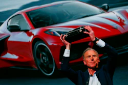 Tadge Juechter, Corvette executive chief engineer, holds up the trophy after the new mid-engine Chevrolet Corvette was named the North American Car of the Year in Detroit, Monday, Jan. 13, 2020. The Kia Telluride took Sport Utility of the Year honors and the Jeep Gladiator won the Truck of the Year Award.