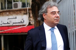 Carlos Abou Jaoude, a lawyer for ex-Nissan chief Carlos Ghosn, leaves the judicial palace where Ghosn was questioned by a Lebanese prosecutor, in Beirut, Lebanon, Thursday, Jan. 9, 2020. Lebanese prosecutors issued a travel ban for fugitive ex-Nissan chief Carlos Ghosn, following an Interpol-issued notice, a judicial official said Thursday.