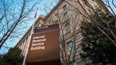 This April 13, 2014, file photo, shows the Internal Revenue Service headquarters building in Washington. A federal judge says it's likely that Microsoft was trying to avoid or evade paying U.S. taxes and is ordering the company to hand over financial documents from more than a decade ago.