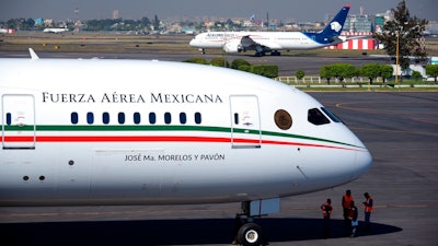 This Dec. 3, 2018 file photo provided by the Mexican Presidential press office shows the presidential airplane at the presidential hangar at Benito Juarez International Airport in Mexico City. Mexico is trying to sell its luxurious presidential jet to Canada, but will raffle the plane off if the Canadians don't want it, President Andres Manuel Lopez Obrador said Tuesday, Jan. 28, 2020.