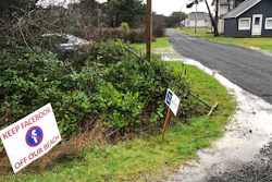 sign expressing opposition to a plan by Facebook to build a landing spot for a submarine cable connecting America with Asia stands on property in the tiny community of Tierra del Mar, Ore., Wednesday, Jan. 8, 2020.