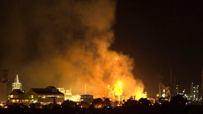 Smoke rises following a big explosion at an industrial hub near the port city of Tarragona, Spain, Tuesday, Jan. 14, 2020. A chemical emergency alert has been activated in northeastern Spain following a big explosion in an industrial zone near the port city of Tarragona, regional emergency services said Tuesday.