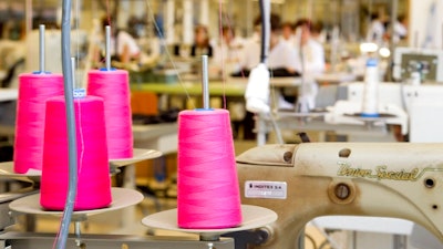This April 10, 2012 file photo shows the production department at fashion giant Inditex's headquarters where Zara fashion garments are designed in La Coruna, Spain. Inditex, the retail giant that owns Zara, H&M and many other brands, announced a sustainability pledge in July, for example, saying it wants all its clothes to be made from sustainable or recycled fabrics by 2025.