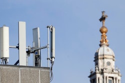 Mobile network phone masts are visible in front of St Paul's Cathedral in the City of London, Tuesday, Jan. 28, 2020.The Chinese tech firm Huawei has been designated a 'high-risk vendor' but will be given the opportunity to build non-core elements of Britain's 5G network, the government has announced. The company will be banned from the 'core', of the 5G network, and from operating at sensitive sites such as nuclear and military facilities, and its share of the market will be capped at 35%.