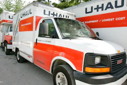 In this June 14, 2006 file photo are U-Haul trucks sit on a dealer lot in Des Moines, Iowa. U-Haul has a New Year's resolution: cut down on hiring people who smoke. The moving company said that it won't hire nicotine users in the 21 states where it is legal to do so, saying that it wants to ensure a 'healthier workforce.' The new policy will start Feb. 1, 2020. and won't apply to those hired before then.