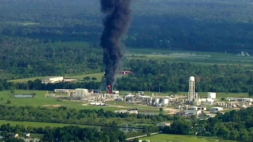 In this Sept. 1, 2017, file photo, smoke rises from the Arkema Inc. owned chemical plant in Crosby, near Houston, Texas. In February 2020, the Pennsylvania-based company, which is a subsidiary of a French chemical manufacturer, and three of its executives are set to stand trial in Houston in a case that legal experts say will be a challenge for prosecutors to win.