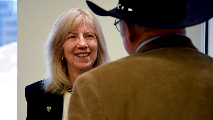 Former Interior Secretary Gale Norton mingles after a news conference in Denver on Monday, Feb. 10, 2020, a day before the Trump administration hosts the first of two hearings on a proposal to roll back a landmark environmental law.