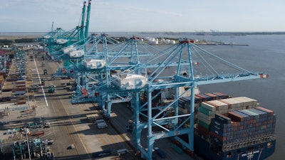 In this May 10, 2019 file photo, a container ship is unloaded at the Virginia International Gateway terminal in Norfolk, VA.