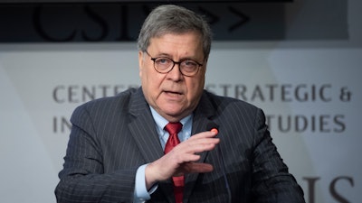 Attorney General William Barr gives the keynote address to the Center for Strategic and International Studies, CSIS China Initiative Conference, Thursday, Feb. 6, 2020, in Washington. (AP Photo/Cliff Owen)