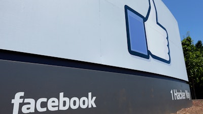 This July 16, 2013, file photo, shows a sign at Facebook headquarters in Menlo Park, Calif.