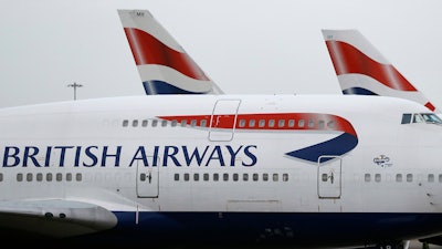 In this Tuesday, Jan. 10, 2017, file photo, British Airways planes are parked at Heathrow Airport in London.