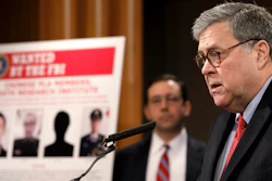 Attorney General William Barr speaks during a news conference, Monday, Feb. 10, 2020, at the Justice Department in Washington, as Principal Associate Deputy Attorney General Seth Ducharm looks on.
