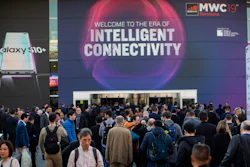 In this Feb. 25, 2019 photo, attendees walk to enter at the Mobile World Congress wireless show in Barcelona, Spain. Organizers of the world’s biggest mobile technology fair are pulling the plug over worries about the viral outbreak from China. The annual Mobile World Congress show will no longer be held as planned in Barcelona, Spain, on Feb. 24-27.