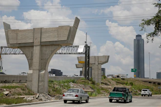 In this July 11, 2019 file photo, construction on the Interstate 69 and Interstate 610 interchange continues in Houston. In the midst of an election year, President Donald Trump has outlined a new $1 trillion infrastructure plan. This time, the Republican president is proposing to rely fully on federal spending to reach his goal, a fundamental change that is praised by some state transportation officials and industry groups, even though Trump's proposal doesn't spell out how to pay for it all.