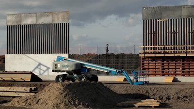 In this Nov. 7, 2019 file photo, the first panels of levee border wall are seen at a construction site along the U.S.-Mexico border, in Donna, Texas.