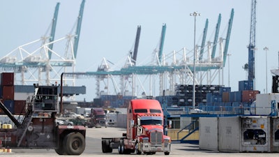 In this Feb. 14 photo, a truck leaves the docks at PortMiami in Miami.