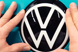 A worker completes an electric car ID.3 body at the assembly line during a press tour at the plant of the German manufacturer Volkswagen AG (VW) in Zwickau, eastern Germany, Tuesday, Feb. 25, 2020.