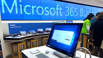 In this Jan. 28, 2020, file photo a Microsoft computer is among items displayed at a Microsoft store in suburban Boston.