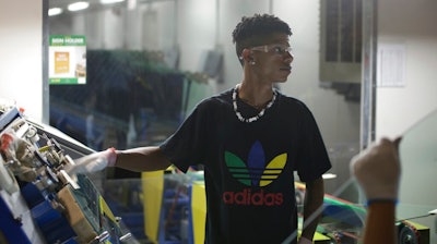 This image released by Netflix shows Zach Ray at work at the Fuyao Glass America factory in Dayton, Ohio, in a scene from the Oscar-nominated documentary 'American Factory.'