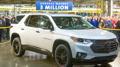 Darrell Kransz, a GM employee for 43.7 years, who also drove the 1 and 2 millionth vehicles produced, positions for a photo in a 2020 Chevrolet Traverse Premier Redline Edition after it rolled off the production line.