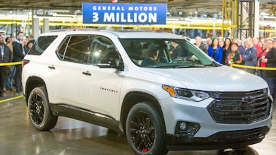 Darrell Kransz, a GM employee for 43.7 years, who also drove the 1 and 2 millionth vehicles produced, positions for a photo in a 2020 Chevrolet Traverse Premier Redline Edition after it rolled off the production line.