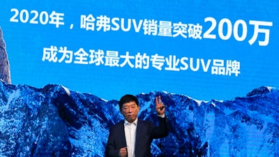 In this Feb. 19, 2017, file photo, Wei Jianjun, chairman of Great Wall Motors Ltd., gestures as he speaks during an event celebrating it sales passing the one million mark, at the Great Wall headquarters in Baoding in north China's Hebei province. General Motors decision to pull out of Australia, New Zealand and Thailand as part of a strategy to exit markets that don't produce adequate returns on investments raised dismay Monday, Feb. 17, 2020 from officials concerned over job losses. The words behind reads 'By 2020, Haval SUV sales will pass 2 million, become the world's biggest specialty SUV brand.'