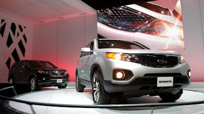 In this Dec. 2, 2009, file photo, the 2011 Kia Sorento debuts at the Los Angeles Auto Show in Los Angeles. Kia is joining its affiliate Hyundai in recalling thousands of vehicles in the U.S. because water can get into a brake computer, cause an electrical short and possibly a fire. The Kia recall covers nearly 229,000 Sedona minivans from the 2006 through 2010 model years. Also covered are Sorento SUVs from 2007 through 2009.