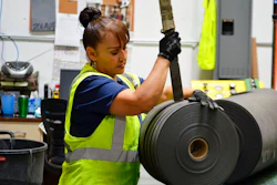 In this May 25, 2018 file photo, an employee at Acme Mills in Santa Teresa, N.M., works to organize textiles. Border trade leaders are expressing optimism for the 2020 trade forecast with Mexico, especially at the busy Santa Teresa Port of Entry in New Mexico, following the new free trade agreement.
